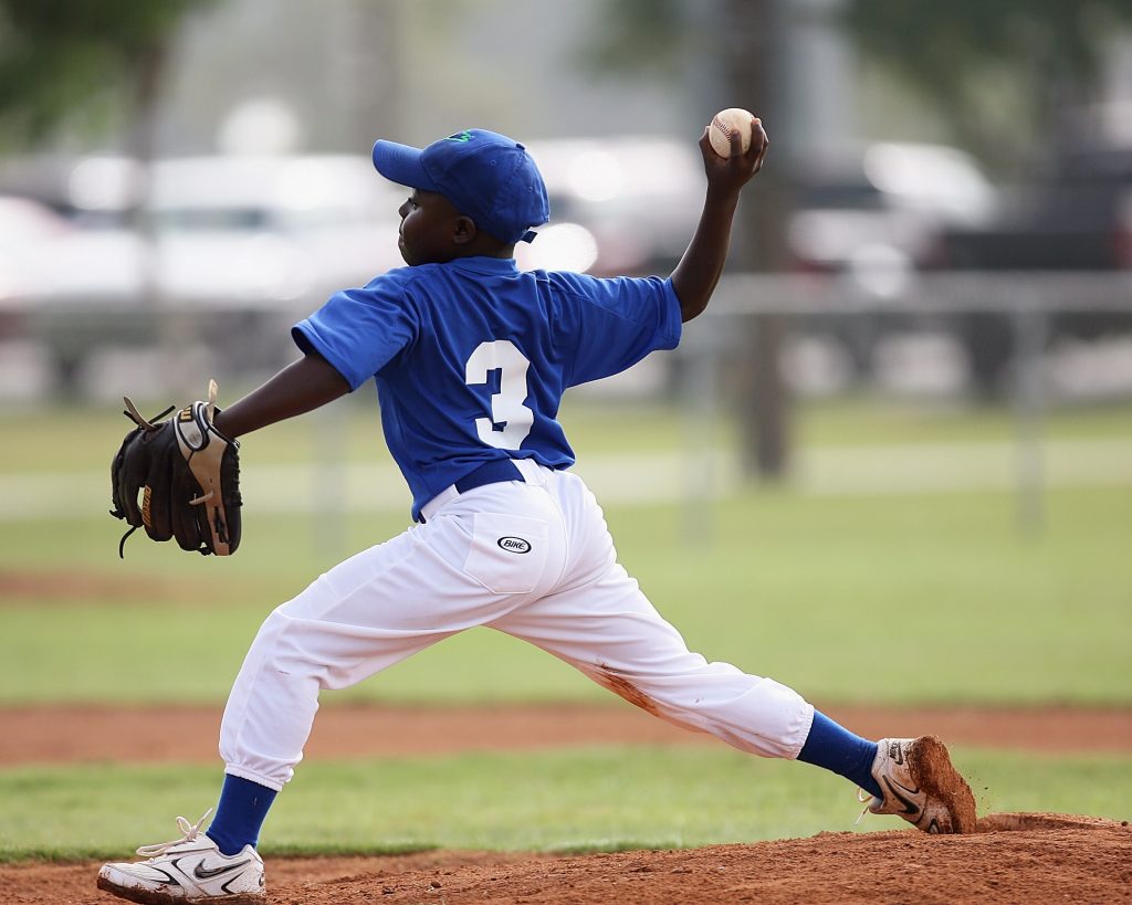 child playing baseball