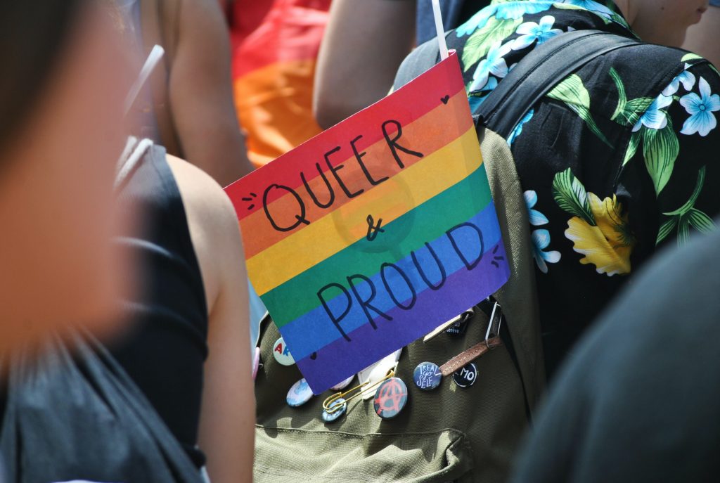 queer and proud sign
